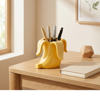 9x9x7cm Banana Shaped Pen Holder Yellow 3D Printed Cute Desk Organizer for Pens Makeup Brushes 3D printing has slight flaws