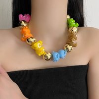 Acrylic colored abacus beads with a tactile paint finish and faceted wheel pendant necklace