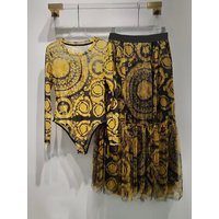 Designer retro geometric printed knitted mesh jumpsuit two-piece 2026 spring women's dress+loose pleated skirt fashion suit