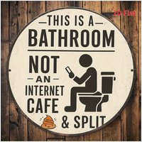 An interesting bathroom sign - wooden humorous decoration, "This is a bathroom - not an Internet cafe" bathroom decoration