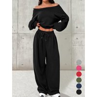 Solid color off shoulder top paired with high waisted wide leg pants fashion set