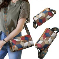The shoulder strap design of this neutral color rectangular crossbody bag features a distinctly ethnic style.