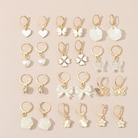 24pcs/set Creative Niche Earrings – Faux Pearl Bow, Flower & Heart Charm, Cute Design-Forward Accessory.
