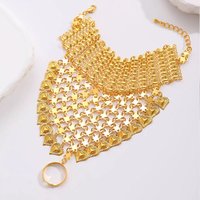 A Retro Ethnic-Style Heart-Shaped Pendant With Flowing Fringes Covering The Back Of The Hand. A Dancing Accessory Bracelet.