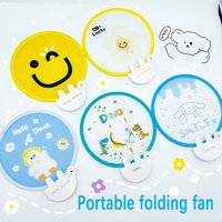 Portable and cute cartoon folding fan with smiling face, compact and exquisite to carry, a must-have for coolness