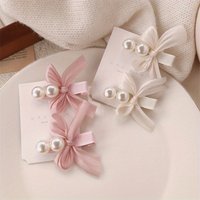 Two elegant bow hair clips, adorned with lace and pearls, suitable for all seasons and perfect for girls' weddings, parties, dan