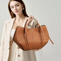 2026 New Versatile Wing Design Shoulder Bag Genuine Leather Large Capacity Commuting Tote Fashionable Hand-Held Bag Unisex Style