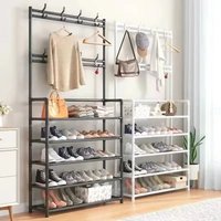 clothes hanger and shoe rack at the entrance used for storing shoes clothes jackets hats bags umbrellas in the hallway