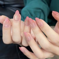 24pcs handmade almond press-on nails. Clear nude fading into peach pink gradient, minimalist blush design. Reusable, ideal for d
