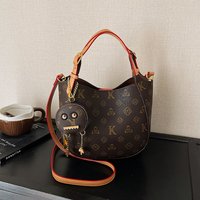 Classic new bucket-shaped large capacity bag with versatile retro print. Single shoulder crossbody bag design featuring small ba