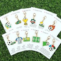12pcs football keychain set, including football jerseys, soccer shoes, and other football-themed keychain sets.