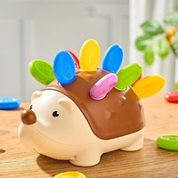Children's educational puzzle toy featuring stuffed hedgehog, with number matching and assembly features