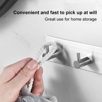 Stainless steel adhesive hooks for hanging clothes on the back of doors, no drilling required for coat hooks.