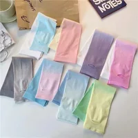 A pair of gradient sunscreen and colorful summer ice silk sunscreen sleeves