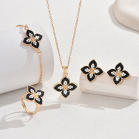 New black flower stud earrings, necklace, bracelet and ring set - a fashionable and sweet jewelry collection set.