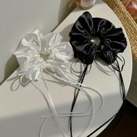 Scrunchie-style scrunchie, cream-white with ribbon and bow, drawstring, satin finish