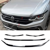Listwy ozdobne na przedni zderzak, grilla, reflektory (brwi, powieki) do Volkswagen Tiguan MK2 R R-Line Facelift 2020-2023, zestawy karoserii