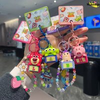 HEROCROSS Toy Story Three Eyed Boy Strawberry Bear Buzz Lightyear Ham Pig Keychain Cartoon Phone Bead Chain Car Acg Pendant Gift