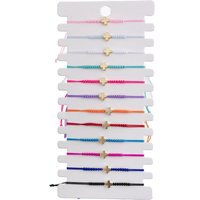 A 12-piece set of simple gilded cross multi-color rope woven fashionable European and American men's and women's bracelets