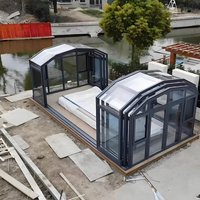 Retractable all-season sunroom system with flat glass roof and custom aluminum structure, suitable for luxury villas and hotels