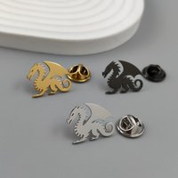 Metal dragon brooch. Unusual flying dragon steel brooch, versatile badge or emblem, an exquisite and compact gift