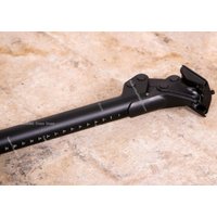 Road gravel for shock-absorbing bike seatpost hybrid