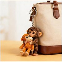 2D funny monkey holding monkey keychain fun impact monkey pendant backpack car key decoration.Protect Punch The Monkey