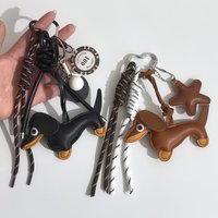 Car keychain pendant Cross-border PU leather sausage puppy car key DIY creative hand-woven rope bag pendant