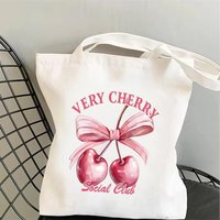 Stylish Coquette Cherry Print Canvas Tote Bag, Shoulder Bag, Cute Bow & Slogan Design Bag for School Work & Casual Outings