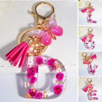 Exquisite 26 Initial Pink Dry Flower Resin Keychain Butterfly Tassel Pendant A to Z Letter Keyring for Women Valentine Day Gift