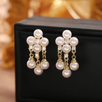 Fashionable and exquisite pearl tassel earrings, high-end, temperament and versatile earrings, niche design, commuter earrings