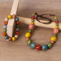 A set consisting of two pieces - a ceramic necklace and a bracelet. Handcrafted ceramic beads. Suitable for daily use by women.