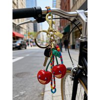 Cute Smiling Cherry Keychain - Red & Green Fruit Bag Charm with Golden Loop, Durable Resin Pendant for Women'S Purse, Backpack