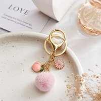 Stylish faux fruit and flower pom pom keychain women style peach design perfect for decorating gift bags