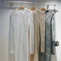 Printemps et été nouveau brillant plein de diamants mince robe mi-longue transparent creux robe de soirée T-shirt sac sauvage jupe de hanche femmes