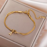 Skyrim Initial Letter Love Knot Bracelets Women Men Couple Stainless Steel Gold Color Snake Chain Bracelets A-Z Alphabet Jewelry