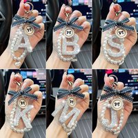 Fashion bow letter keychain creative exquisite pearl chain English car keychain ring women's bag pendant decoration gift