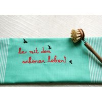 Hirschkind Handgewebtes Fair-Trade-Bio-Geschirrtuch "her mit dem schönen leben!" türkis