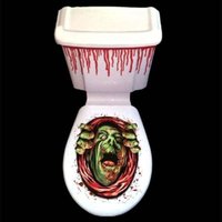 Spooky Halloween decoration for the toilet. Dripping blood to attach to the tank. On the toilet seat, a zombie tries to crawl out of the bowl.