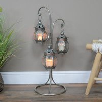 Click to view product details and reviews for Grey 3 Hanging Lanterns On Stand Set Of 2. Click to view product details and reviews for Grey 3 Hanging Lanterns On Stand Set Of 2.