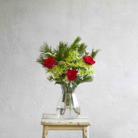 Christmas flower bouquet with red roses and green highlights | Send flowers online | Santa's Sleigh | size: letterbox image