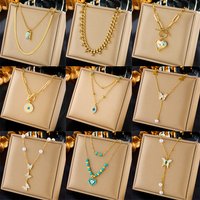 Fashionable niche creative simple pearl butterfly colorful rhinestone love pendant tassel chain layered necklace