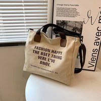 Designer fashion personality trend Simple canvas large capacity leisure bag lazy style one shoulder printed letter Tote bag