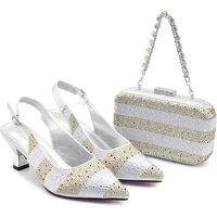 Accessorize the evening with shredded diamond embellished high-heeled sandals and a hard-box handbag set