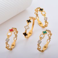 Diamond Encrusted Titanium Steel Bracelet Hollowed out Four Leaf Clover Design Colorfast Spring Buckle High End Feel
