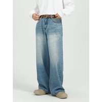 Men’s outfit is baggy with blue straight leg wide-leg jeans