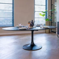 View Blax black geometric cube 10 seater oval dining table with tulip base View Blax black geometric cube 10 seater oval dining table with tulip base