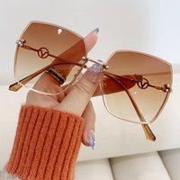 New frameless cut edge women’s fashion metal large frame gradient light sunglasses for driving sun visors ins