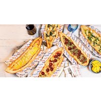 Savor Authentic Turkish Pide with a Refreshing Drink