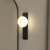 Lindby vägglampa till bad Tavrik, svart/vit, höjd 30 cm, glas